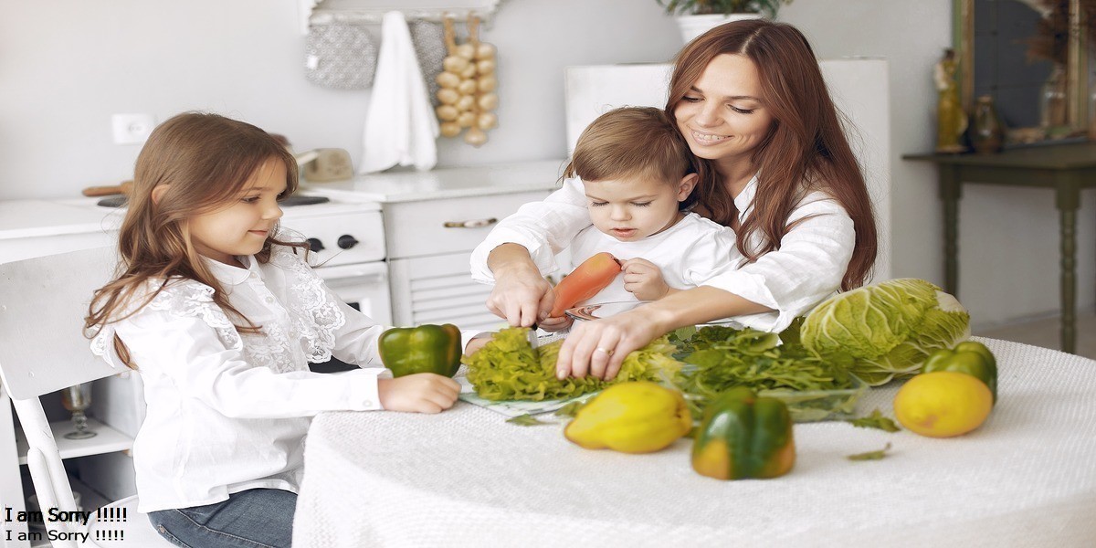 a woman and children cutting vegetables