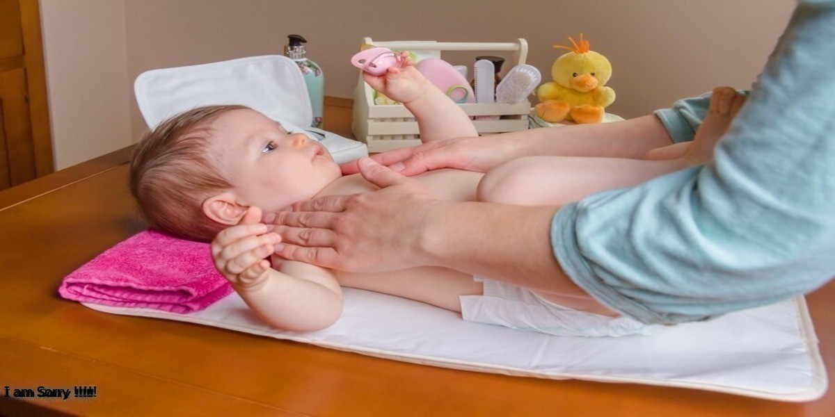 a baby lying on a table